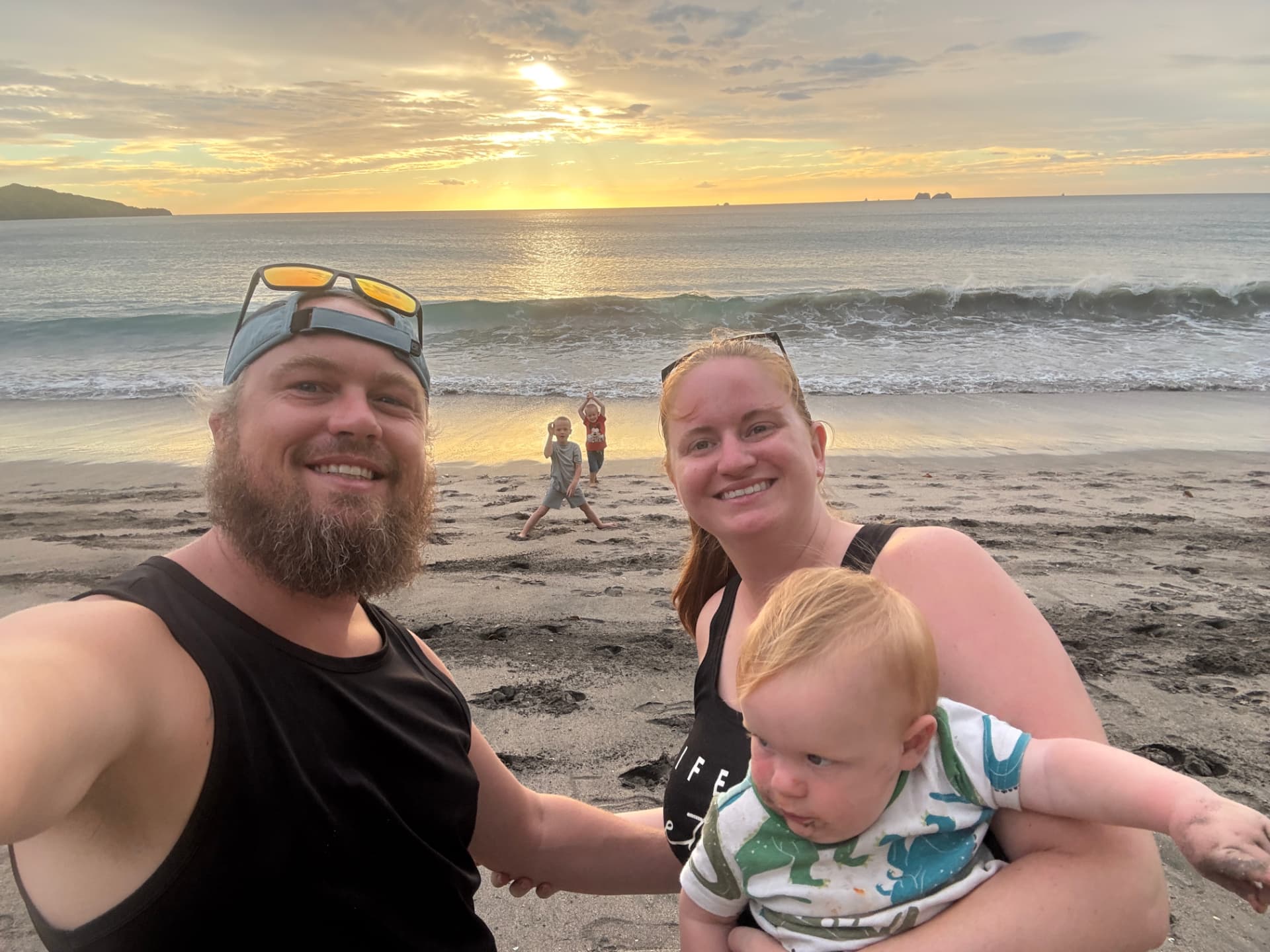 Our family together at sunset on the beach
